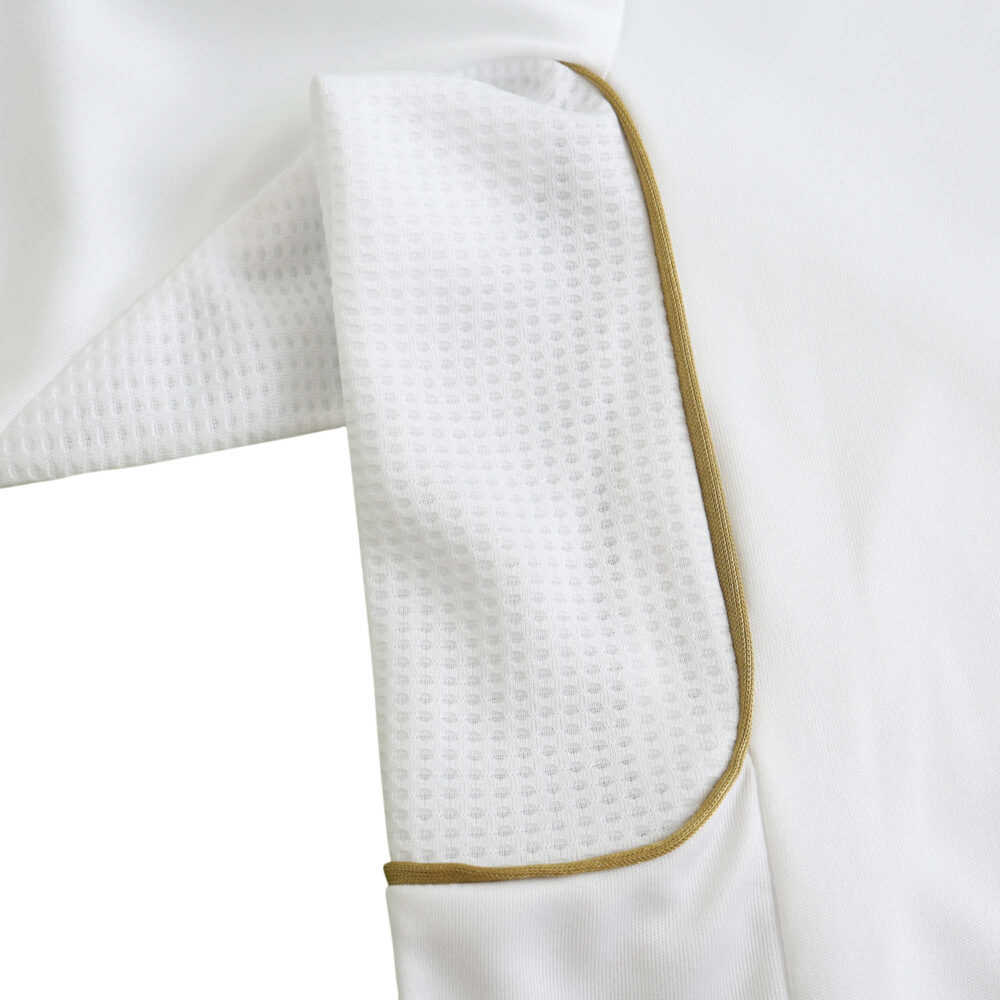 Close-up view of the sleeve section of Real Madrid Retro Home 2011/12 Player Version jersey, showcasing white fabric with gold trim.