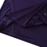 Close-up of the Real Madrid Retro Third 2010/11 Fan Version jersey in deep purple, displaying stitching and fabric detail.