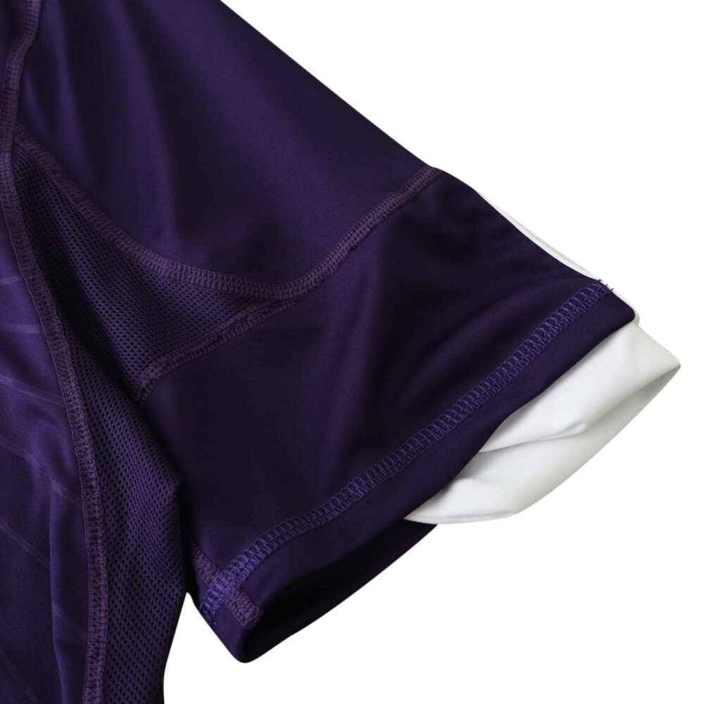 Close-up of the sleeve of a Real Madrid Retro Third jersey from the 2010/11 season in a fan version. The color is deep purple.