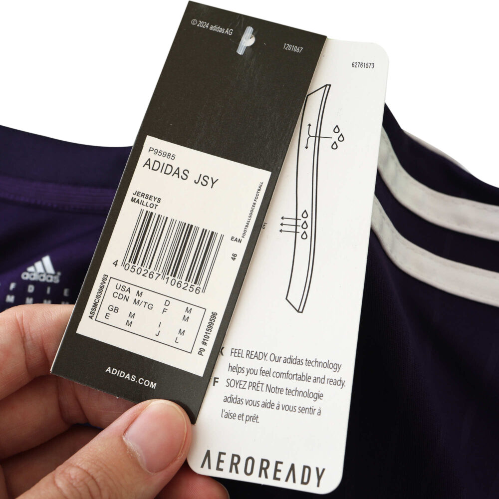 Tag and label details of Real Madrid Retro Third Fan Version jersey from 2010/11 season; highlights Adidas logo and AEROREADY.