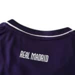 Close-up view of the back collar of Real Madrid Retro Third 2010/11 Fan Version jersey, showcasing the "REAL MADRID" text.