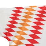 Close-up of the Spain Retro Away 1994 Fan Version jersey sleeve, featuring a red and orange diamond pattern on white fabric.