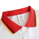 Close-up of Spain Retro Away 1994 Fan Version jersey with a red collar and Adidas label.