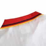 Close-up of the collar on a Spain Retro Away 1994 Fan Version jersey, featuring a red, yellow, and black stripe design.
