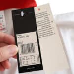 Close-up of product tags inside the Spain Retro Away 1994 Fan Version jersey by Adidas.