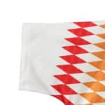 Close-up of the sleeve design on the Spain Retro Away 1994 fan version jersey, featuring red and orange diamond patterns.