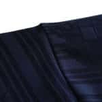 Close-up of the Spain Retro Away 1996 jersey fabric, showcasing the detailed texture and dark blue color.