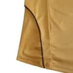 Close-up of the Spain Retro Away 2008 Fan Version jersey, featuring gold fabric and black piping on the side.