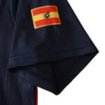 Close-up of the Spain Retro Home 1996 fan version jersey sleeve with flag patch.