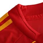 Close-up of the Spain Retro Home 2008 Fan Version jersey's red collar and yellow stripe detailing.