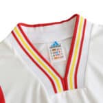 Close-up view of the collar on the Spain Retro Third 1996 fan version jersey, featuring red and yellow stripes.