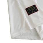 Close-up of the Spain Retro Third 1996 Fan Version jersey showing fabric texture and official Federación Española de Futbol badge.