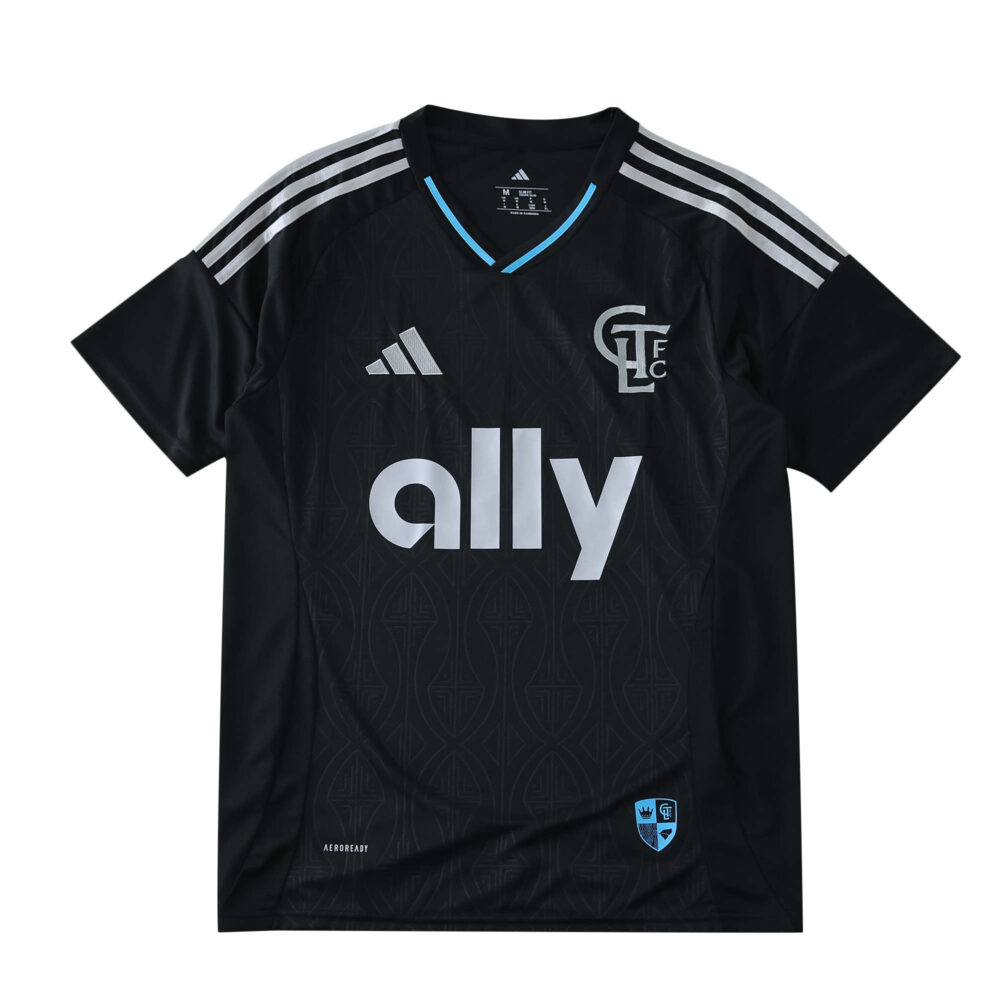 Charlotte FC 2025/26 Away Fan Version jersey in black with silver stripes and sponsor logo on the front.