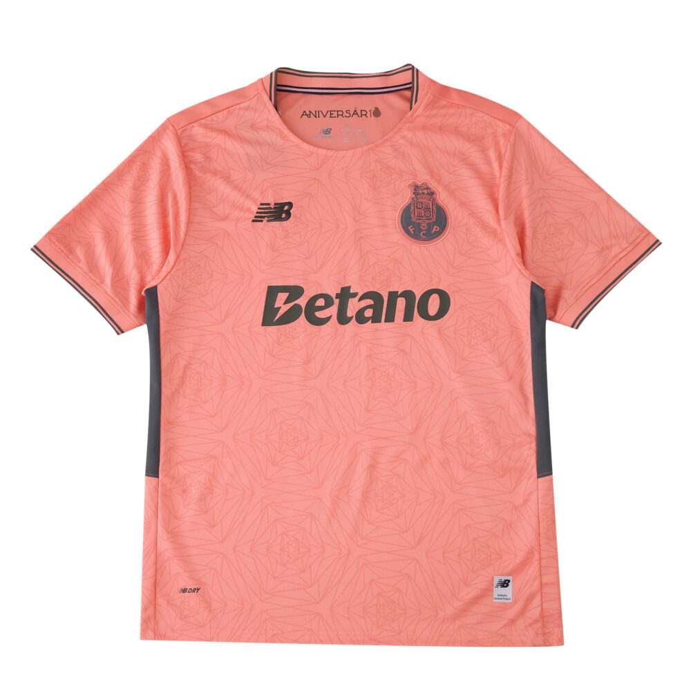 FC Porto 2025/26 away fan jersey in coral pink with sponsor, club crest, and New Balance logo.