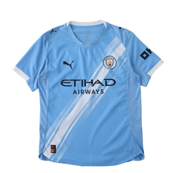 Manchester City Home 2025/26 Player Version jersey in light blue with white diagonal stripes and sponsor logos.