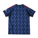 Back view of Arsenal Away 2025/26 Fan Version jersey with blue zigzag pattern and red shoulder stripes.
