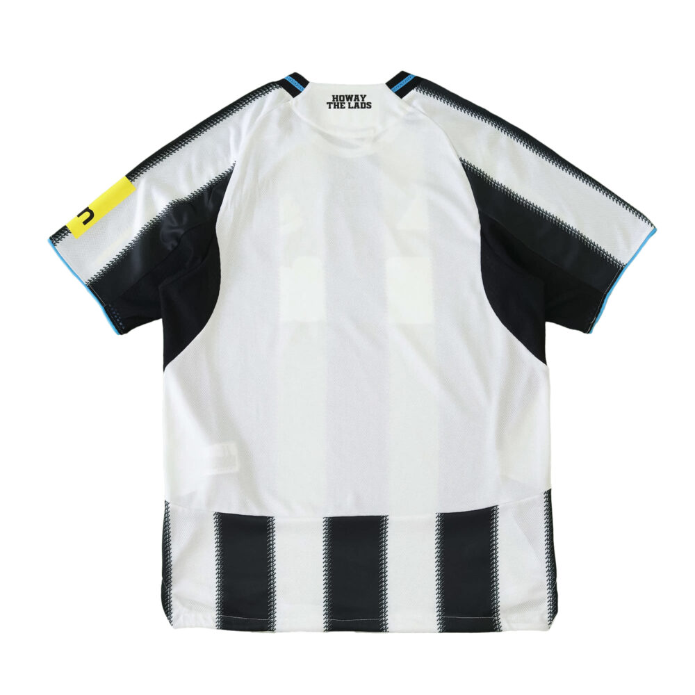Back view of Newcastle United 2025/26 home player jersey with black and white stripes and yellow sleeve detail.