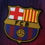 Close-up of the FC Barcelona crest on the 2025/26 home player version jersey.