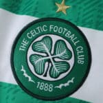 Close-up of Celtic FC 2025/26 home jersey badge featuring club crest and single gold star.