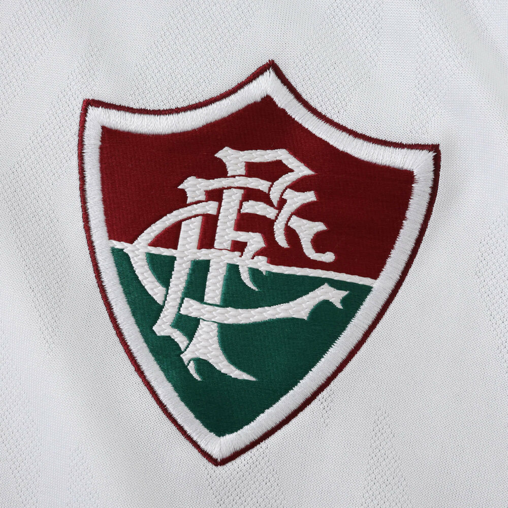 Fluminense club crest embroidered on the white fabric of the Away 2025/26 Fan Version jersey.