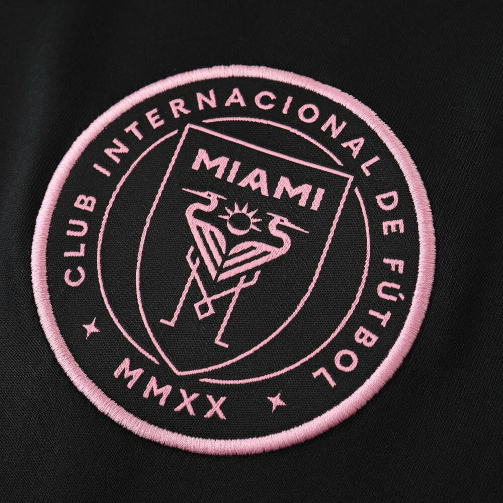 Inter Miami CF 2025/26 away fan jersey badge with pink club crest on black fabric.