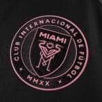 Inter Miami CF 2025/26 Away Player Version jersey badge with pink club crest on black fabric.