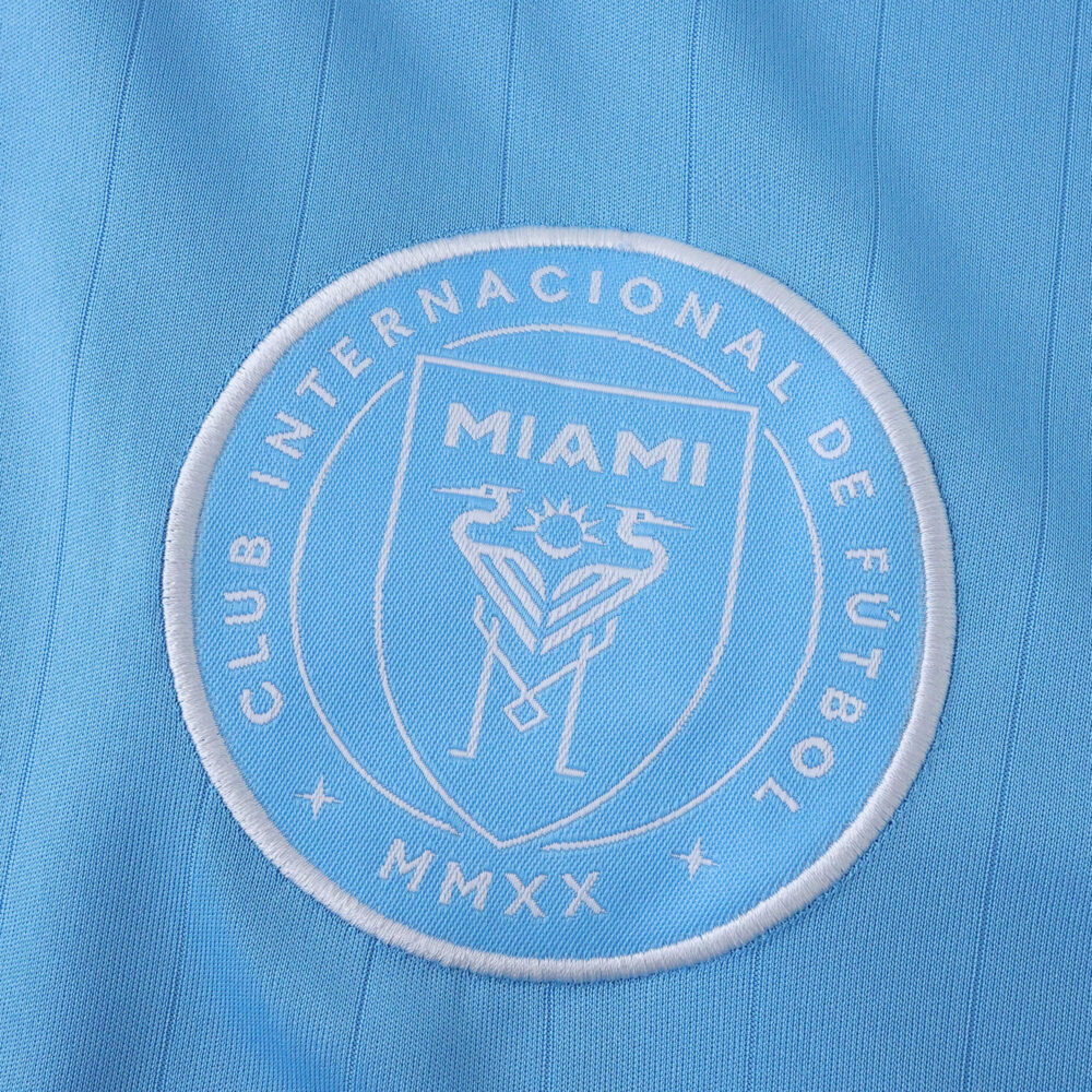Close-up of Inter Miami CF crest on the 2025/26 Third Fan Version jersey in light blue fabric.