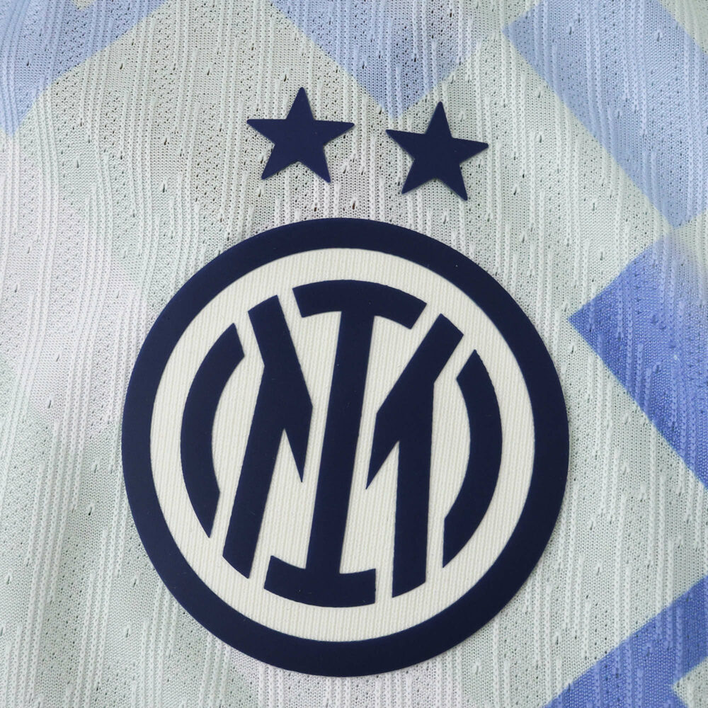Close-up of Inter Milan crest with two stars on the 2025/26 away player version jersey.
