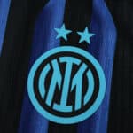 Close-up of Inter Milan 2025/26 Home Player Version jersey featuring club crest and blue-black stripes.