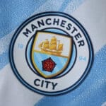 Manchester City home 2025/26 player version kit badge featuring club crest on light blue and white fabric.
