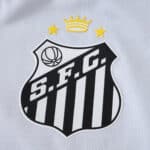 Santos FC 2025/26 Home Player Version jersey crest with two stars and a crown above the S.F.C. badge.