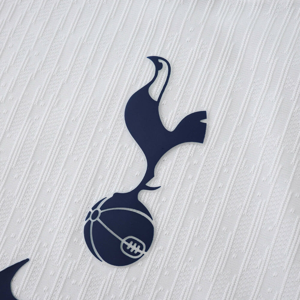 Close-up of the Tottenham Hotspur crest on the 2025/26 Home Player Version jersey fabric.