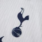 Close-up of the Tottenham Hotspur crest on the 2025/26 Home Player Version jersey fabric.
