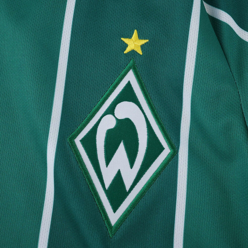 Werder Bremen 2025/26 Home Fan jersey detail with club crest and yellow star on green fabric.