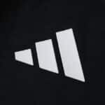 Close-up of the Adidas logo on the Aston Villa Away 2025/26 Player Version jersey fabric.