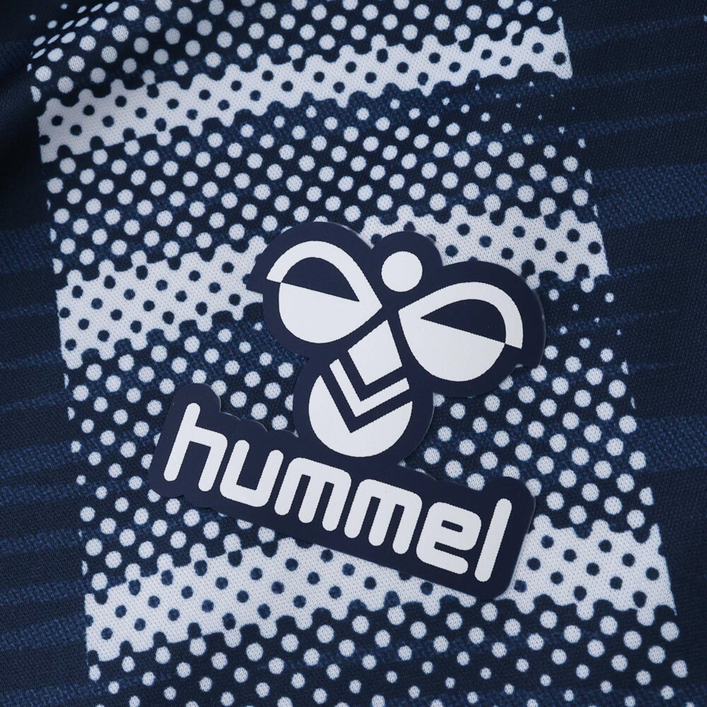 Close-up of the Hummel logo on the Celta Vigo Away 2025/26 Fan Version jersey with a dotted pattern.