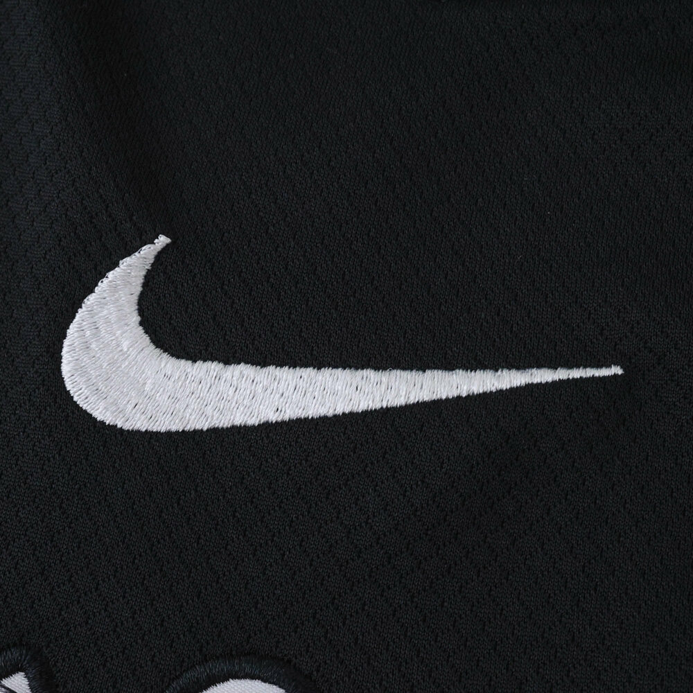 White Nike logo embroidered on black fabric of Corinthians Away 2025/26 Fan Version jersey.