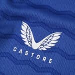 Close-up of the Castore logo on the blue Everton 2025/26 home fan version jersey.