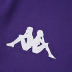 Close-up of the Fiorentina 2025/26 Fan Version jersey showing the white Kappa logo on purple fabric.