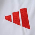 Close-up of the red Adidas logo on the Flamengo Away 2025/26 Fan Version jersey.