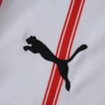 Close-up of Girona Home 2025/26 Fan Version jersey showing Puma logo and red stripes on white fabric.