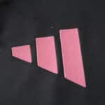 Close-up of pink adidas logo on the 2025/26 Inter Miami CF Away Player Version jersey fabric.