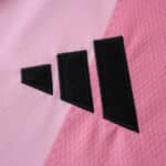 Close-up of the black Adidas logo on the pink Inter Miami CF 2025/26 Home Fan Version jersey.