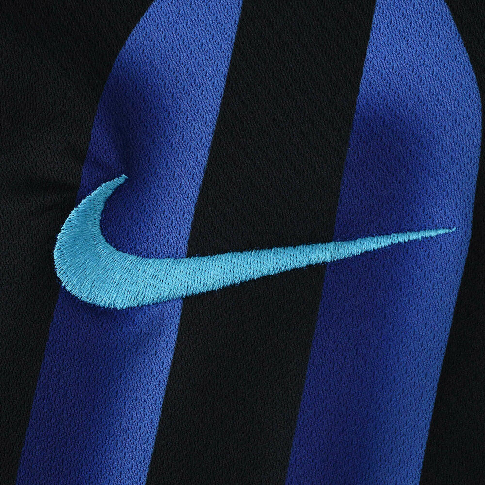 Close-up of the Nike logo on the Inter Milan Home 2025/26 Fan Version jersey with blue and black stripes.