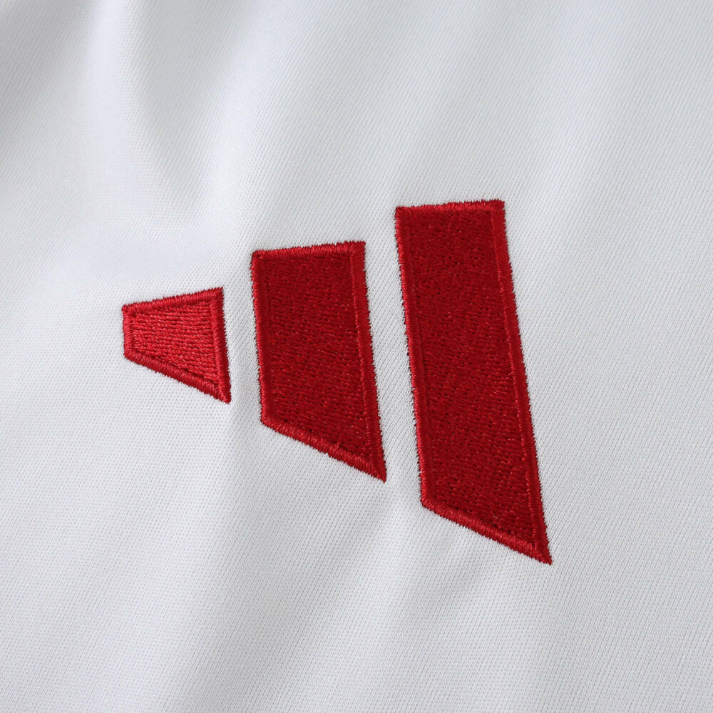 Close-up of the red Adidas logo on the white Liverpool Away 2025/26 Fan Version jersey.