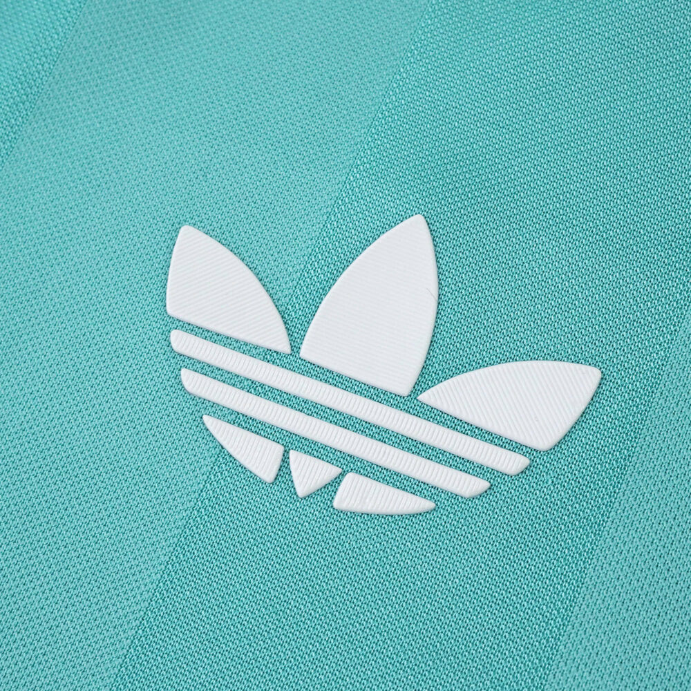 Close-up of the white Adidas logo on the Liverpool Third 2025/26 Player Version jersey in teal.