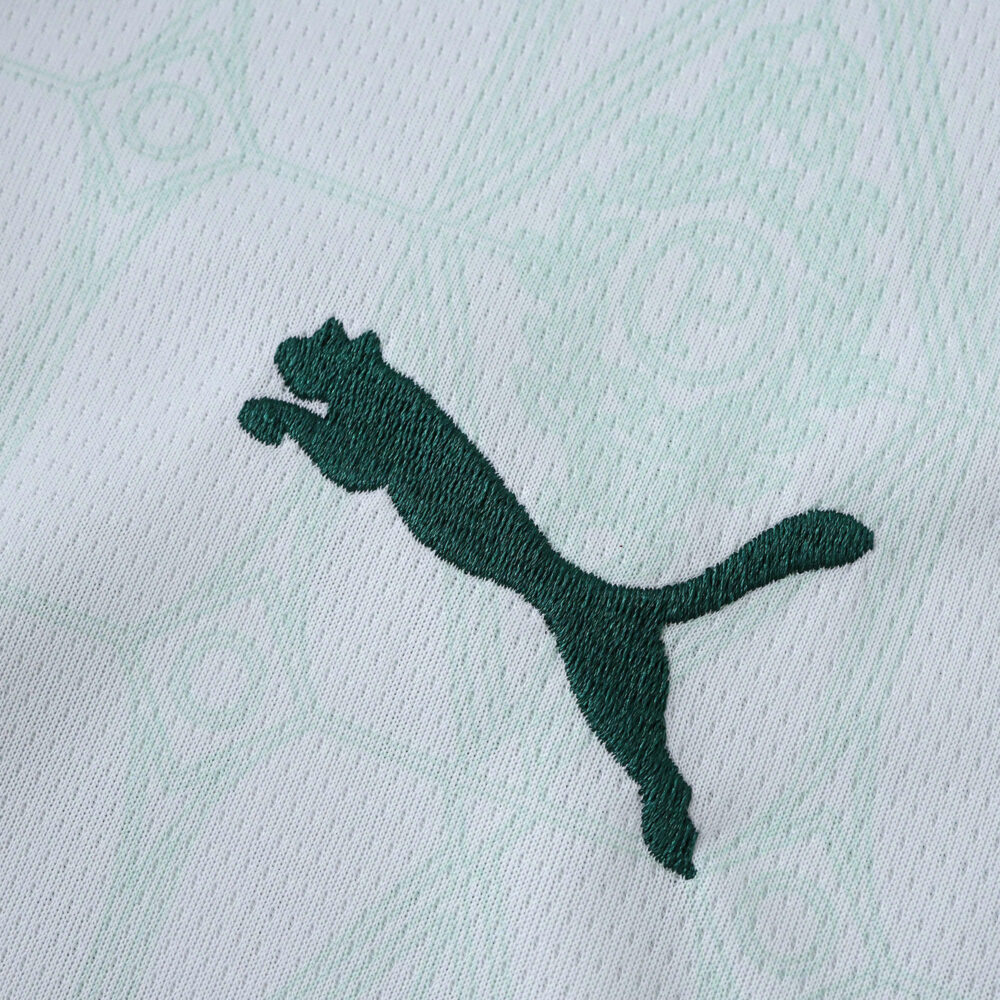 Close-up of the green Puma logo on the Palmeiras Away 2025/26 Fan Version jersey fabric.