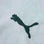 Close-up of the green Puma logo on the Palmeiras Away 2025/26 Fan Version jersey fabric.