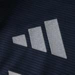 Close-up of the adidas logo on the 2025/26 Real Madrid Away Player Version jersey fabric.