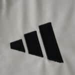 Close-up of the black Adidas logo embroidered on the SL Benfica Away 2025/26 Fan Version jersey fabric.